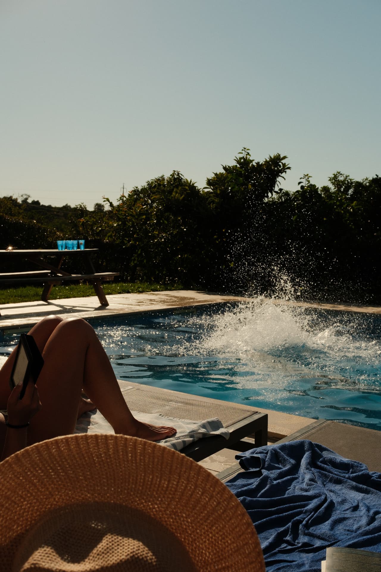 Cannonball splash in the pool at golden hour